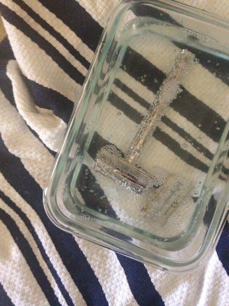 A safety blade in a homemade razor blade cleaner solution