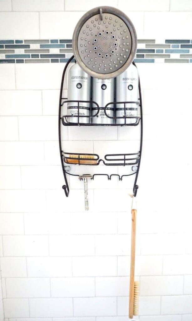 eco friendly shampoo and conditioner with other shower items on a shower caddy