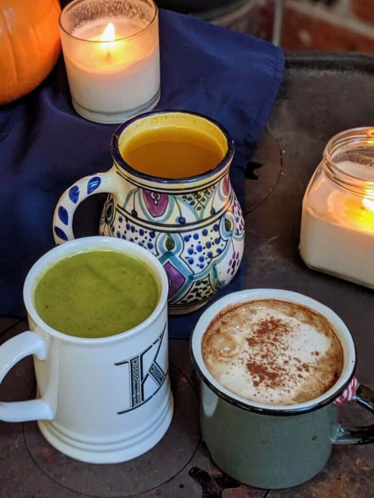 close-up image of three mugs filled with hot drinks