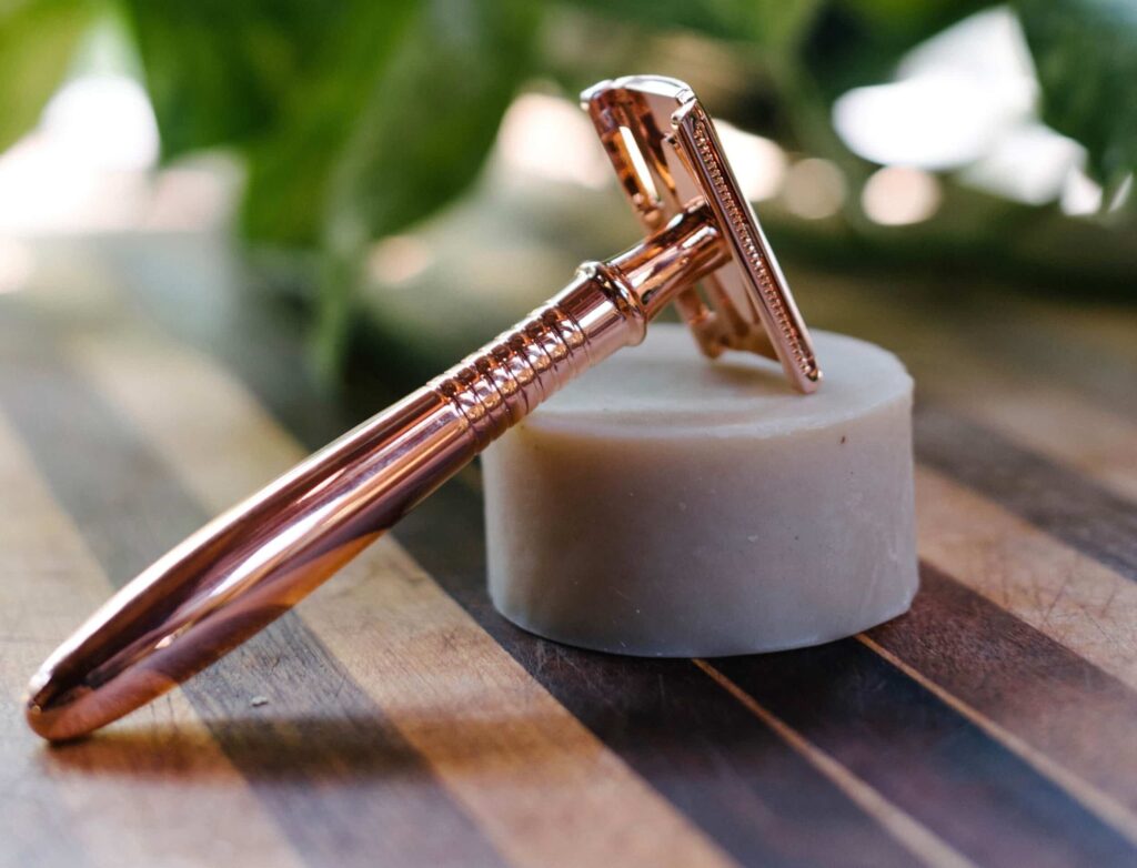 close-up image of a rose gold colored safety razor, a sustainable swap for disposable razors