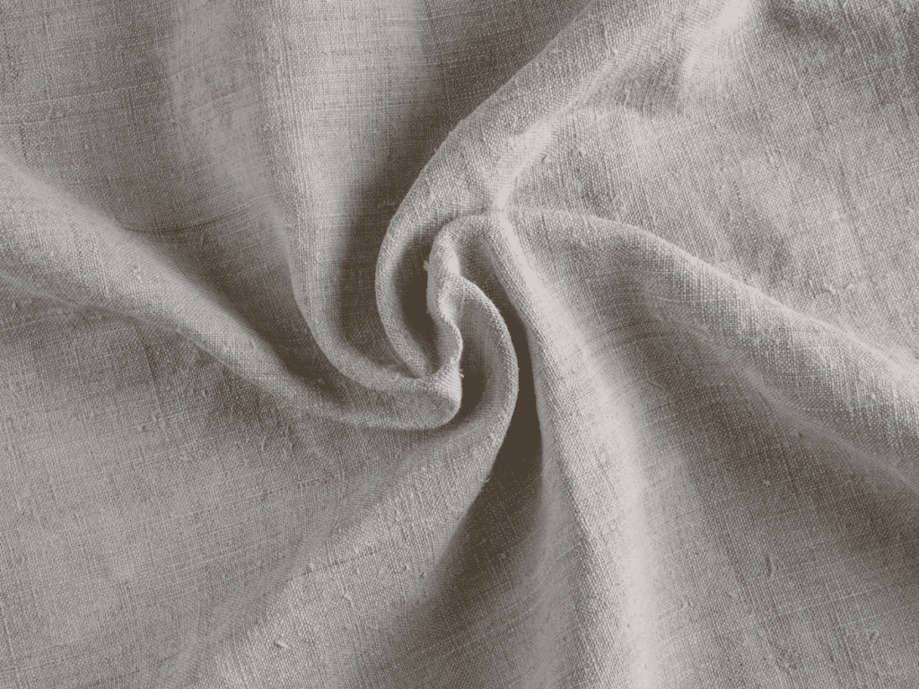Overhead image of hemp fabric scrunched up to show: how does hemp fiber feel?