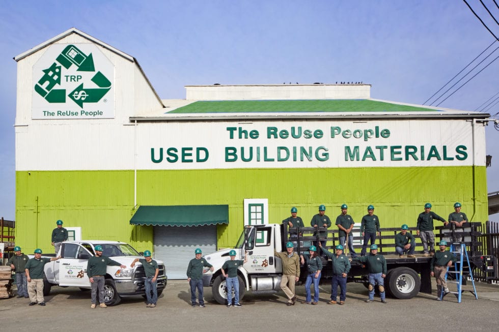 image of a team of people standing outside a used building materials reuse center