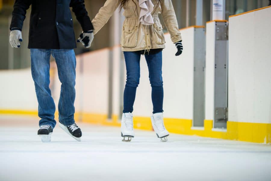 couple ice skating as an example of experience gifts for couples