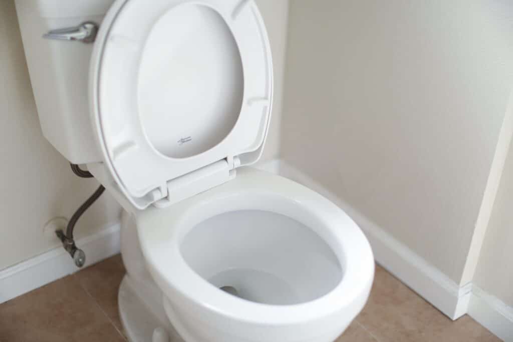 image of a toilet with an open lid and clean toilet bowl