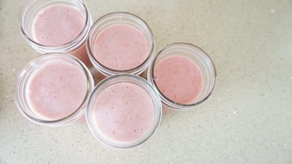 Top view of filled smoothie jars. 