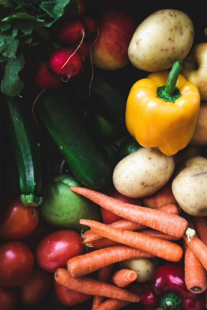 Close up of various produce items like bell peppers, carrots, and zucchini to illustrate an Amazon alternative for groceries