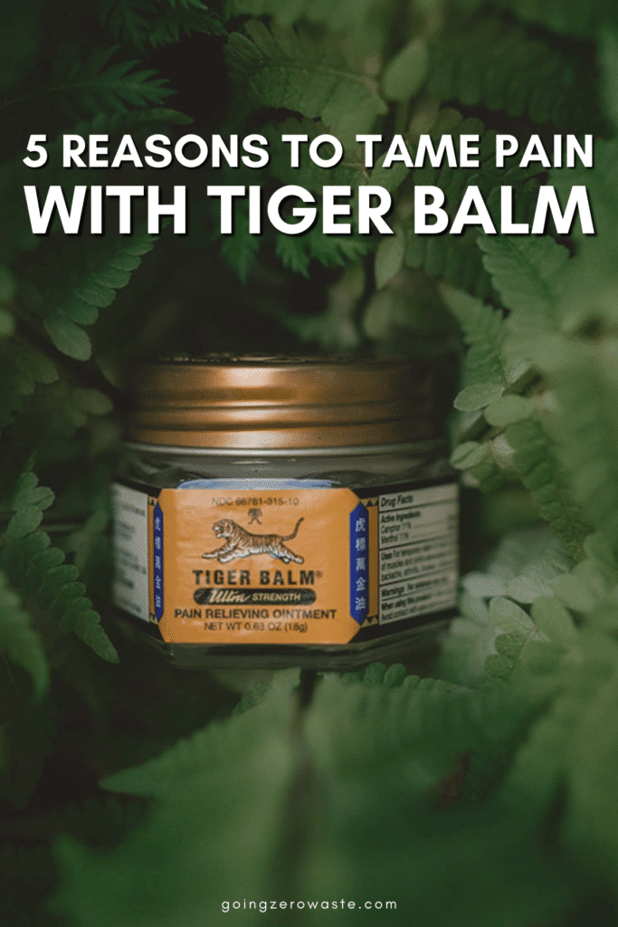 A photo of tiger balm ointment in greenery with overlay text reading "5 Reasons to Tame Pain with Tiger Balm" 