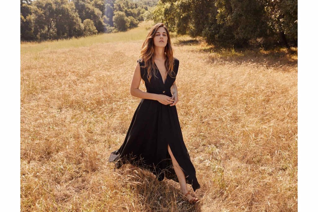 Woman wearing a beautifully dress made by sustainable dress brands