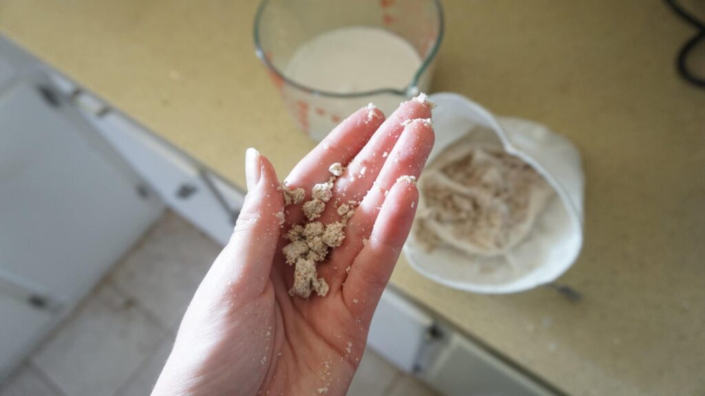 Almond pulp leftover after straining an almond milk bag.